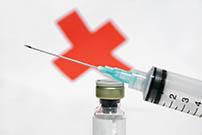 Syringe and red cross